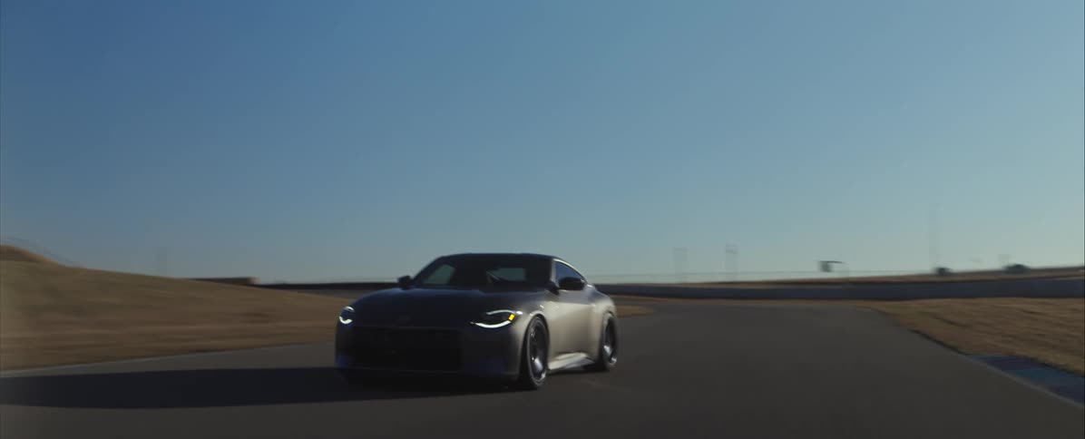 A view of a car driving down a track
