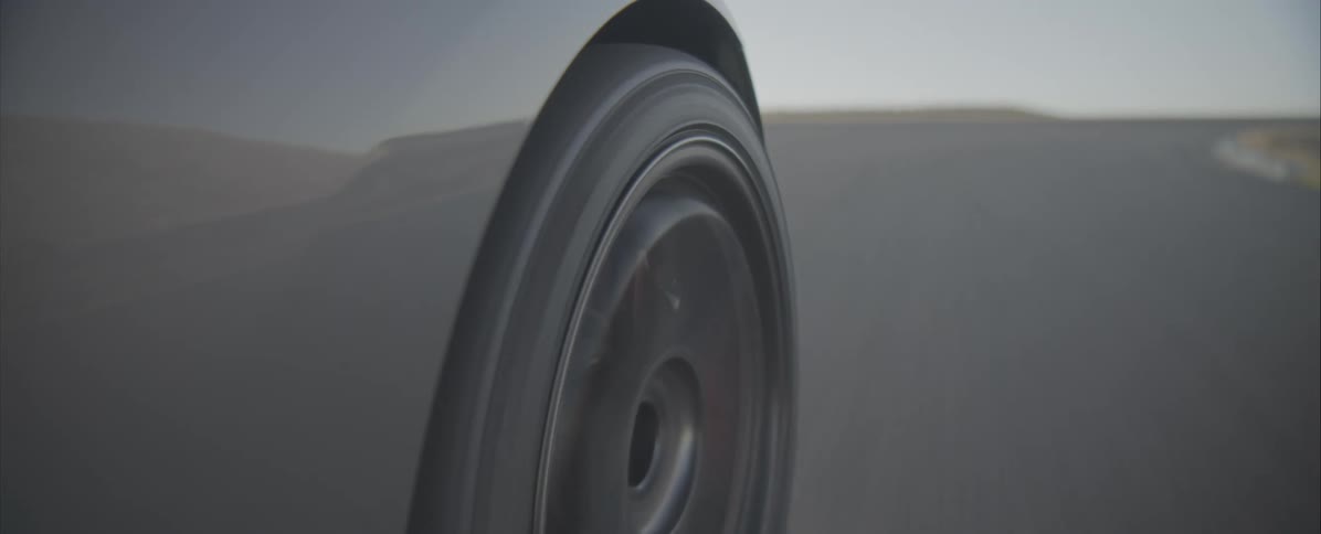 A cars wheel as it drives