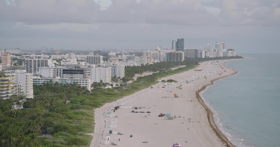 A view of a beach on the edge of a city
