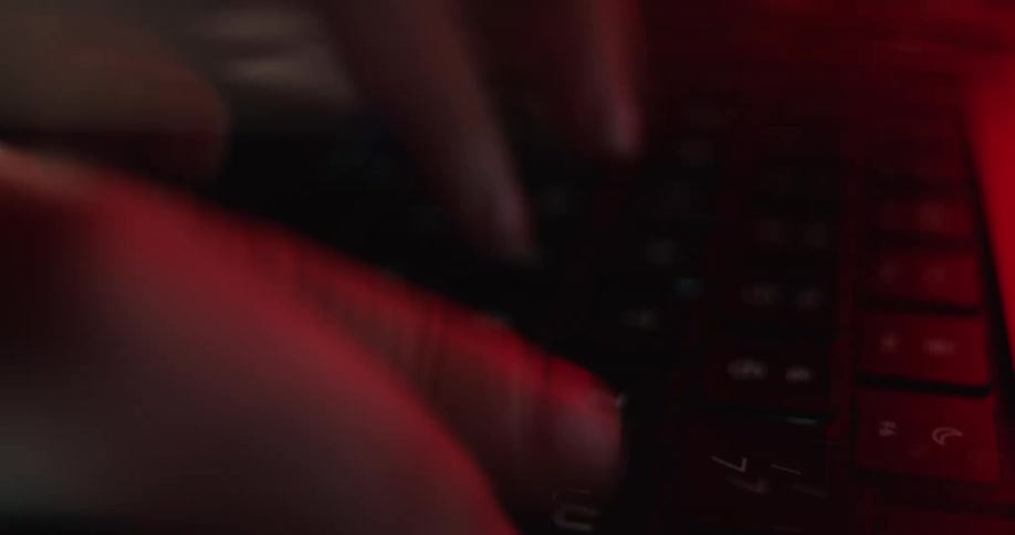 A person typing on a keyboard