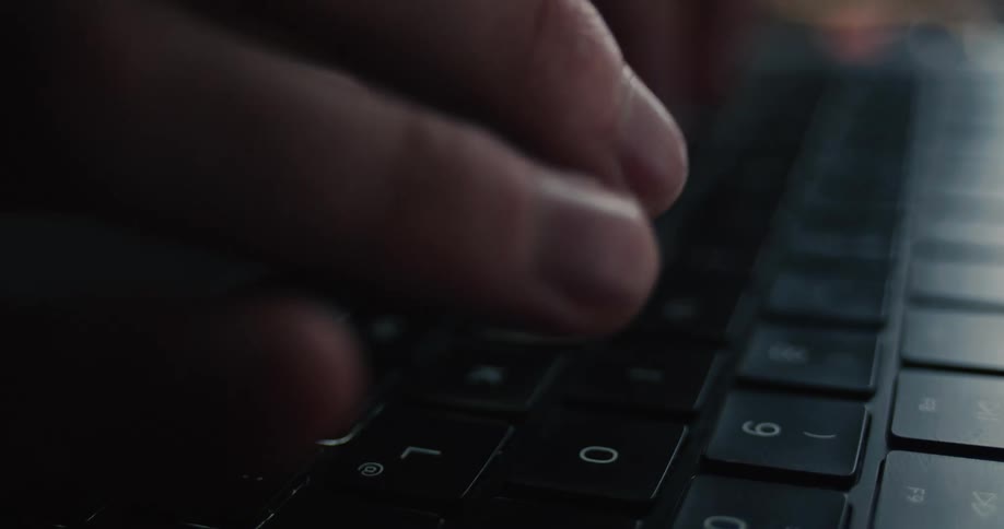 A person typing on a keyboard