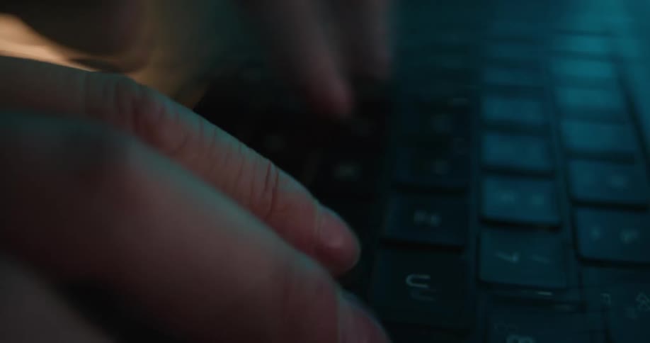 A person typing on a keyboard