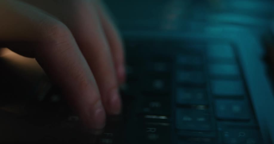 A person typing on a keyboard