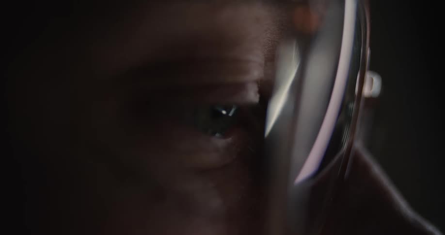 A close up of a person with glasses