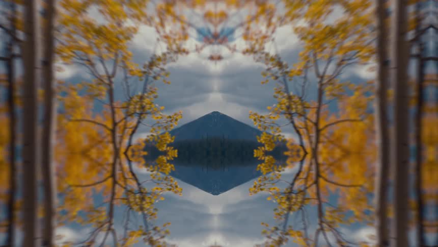 A view of a mountain at the edge of a lake