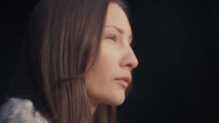 A portrait of a woman with natural lighting on her face