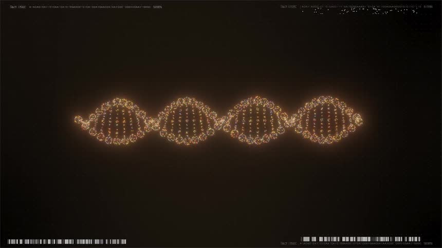 A computer generated glowing dna double helix rotates against a dark background