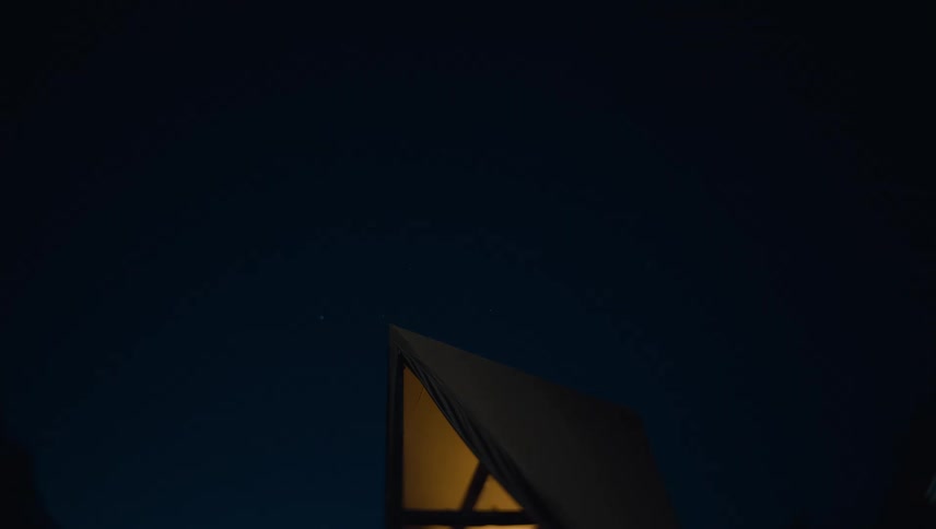 Light illuminates a shelter with an angular top and then it fades