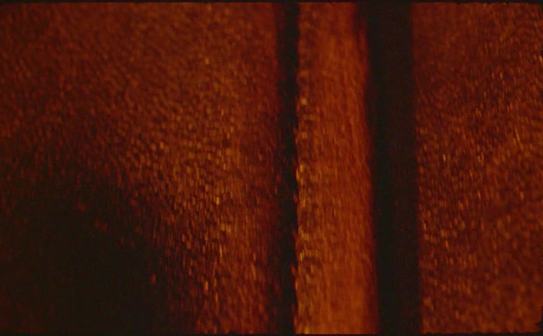 Close up of a dark coloured leather fabric