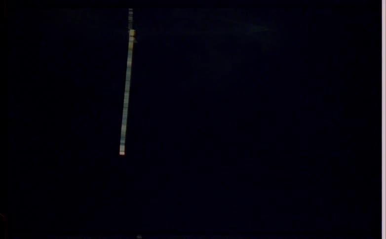 A string swinging at night