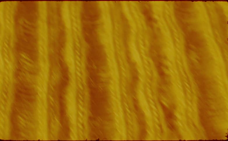 A closeup of the surface of a woven piece of fabric made with thick threads