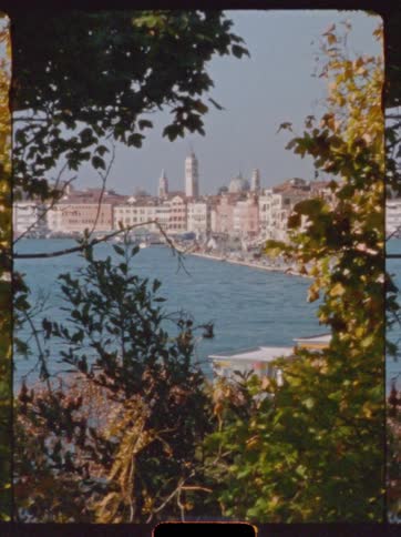 A view of some buildings along the edge of water