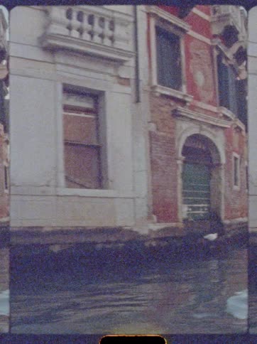 Historic building by the canal lit by the evening light