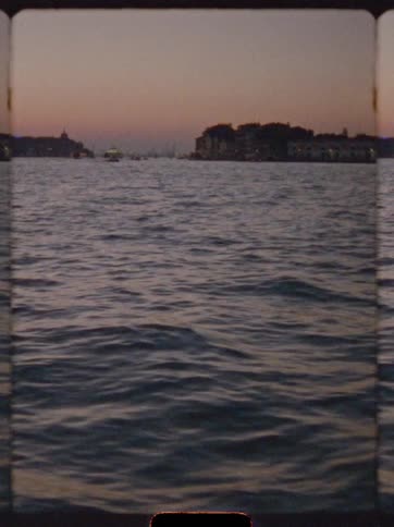 Evening sea view with islands in the background framed like old film