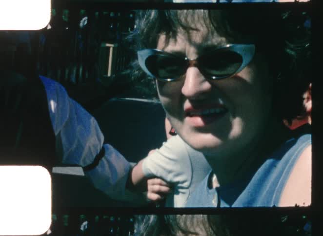 Woman wearing dark sunglasses in an outdoor closeup