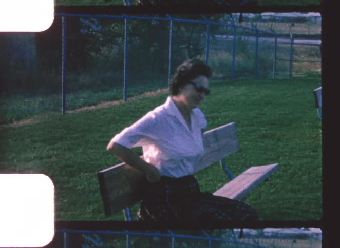 A portrait of a woman sitting on a bench