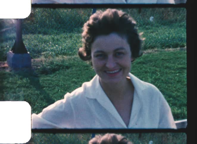 Woman outdoors with grass in the background