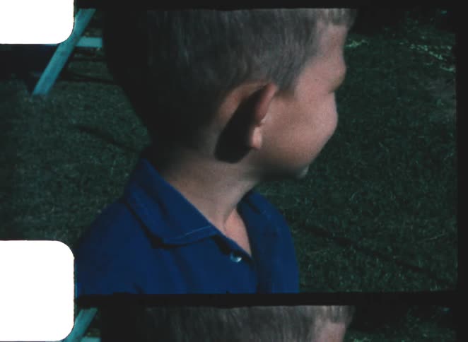A portrait of a child outdoors on a sunny day