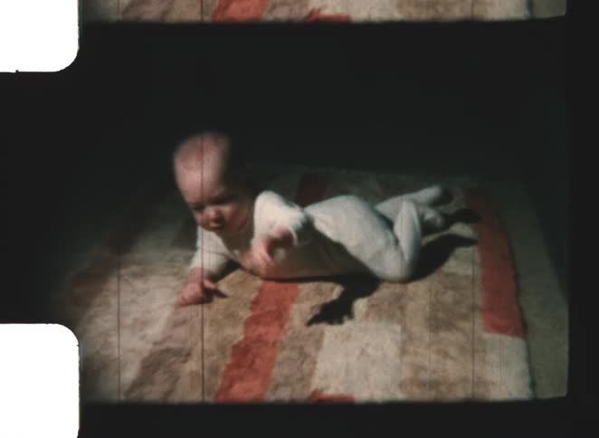 A baby crawls on the floor