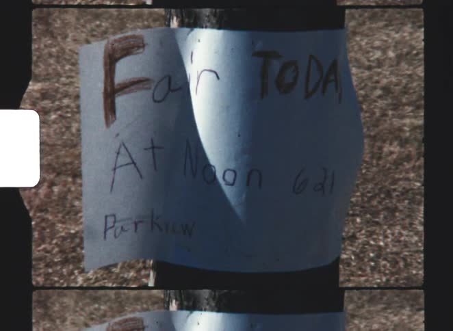 A close up of a sign on a pole