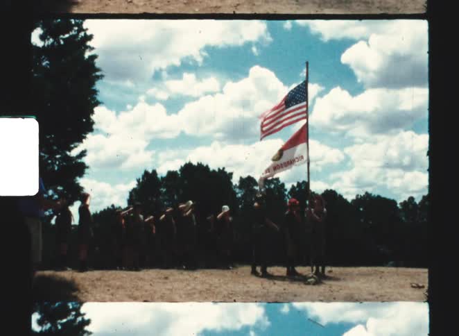 A group of people raising a flag