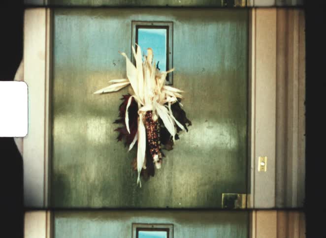 Person closes door with decoration