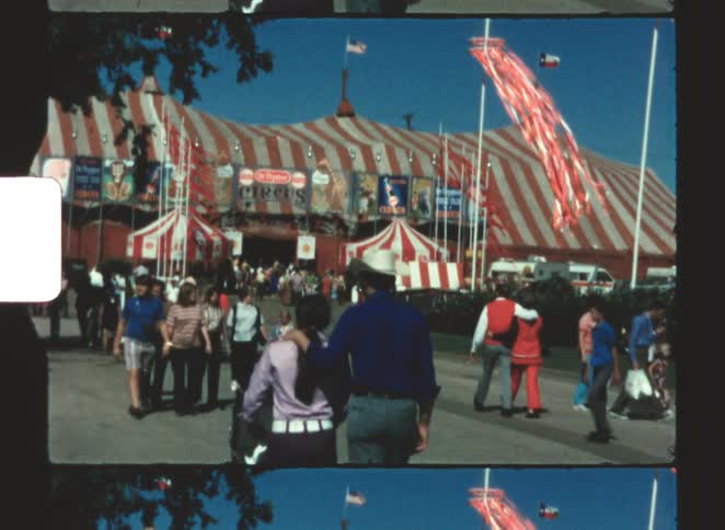 A group of people walking to a fair