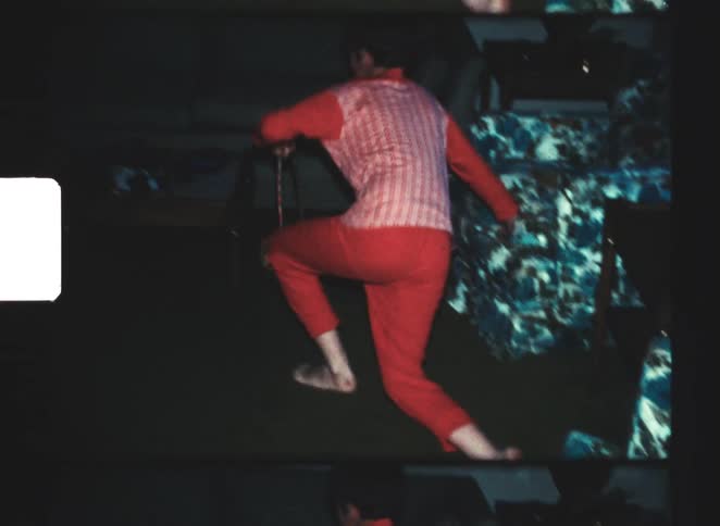 The child is searching for easter eggs in the living room