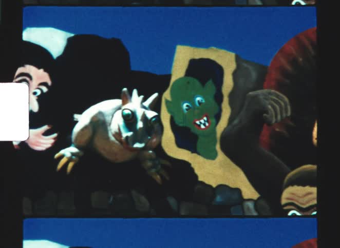 Closeup of vintage style creepy cartoon characters emerging against a blue background