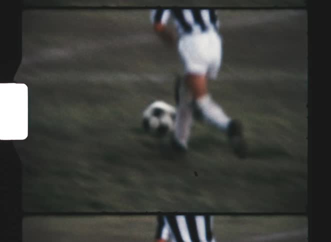 Young players compete fiercely on the expansive grassy soccer field