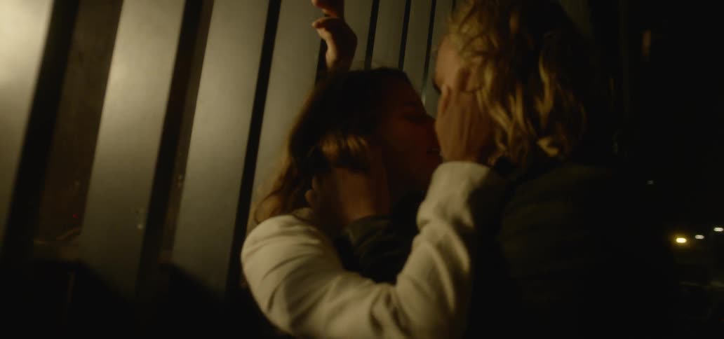Two people are making out at night