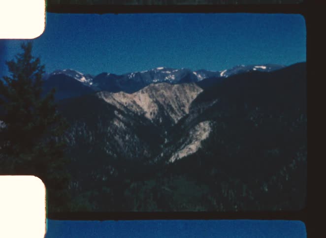 Snowy peak in background under blue sky