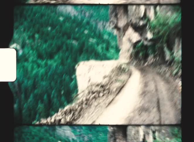 A view of a mountain with trees on it