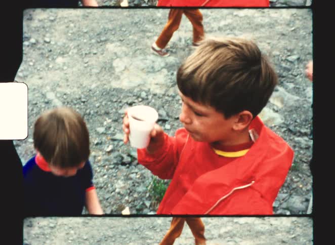Two kids standing outdoors