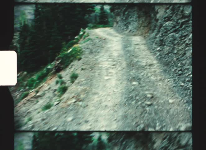 A view of a rocky road in a mountain area
