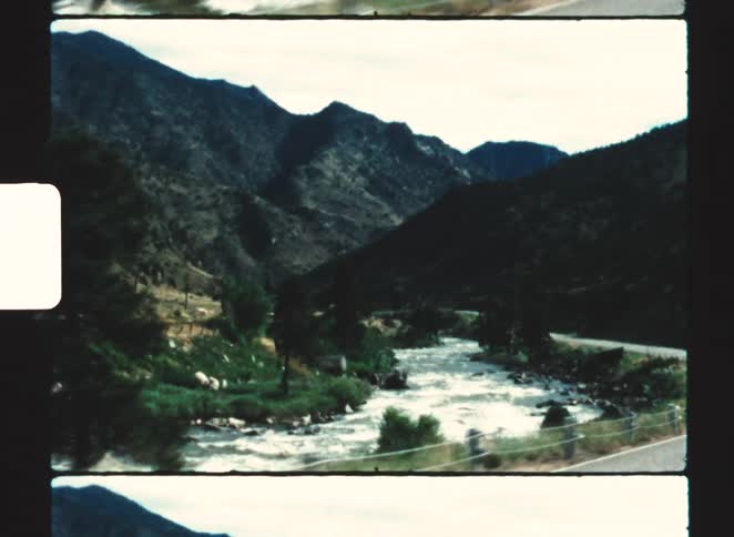 A view of a river and mountains outdoors