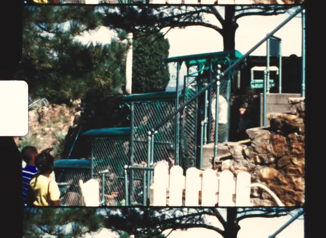 Vintage footage captures the unique cagestyle tram of the royal gorge incline descending the steep canyon tracks as fascinated children watch from the safety of the rim