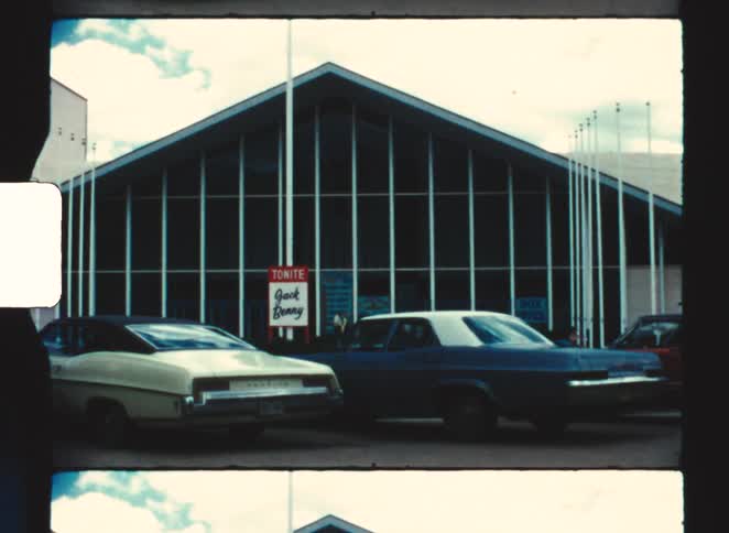 Some cars sitting in a parking lot