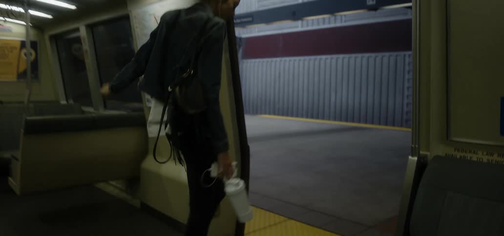 A woman rides the subway