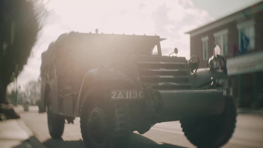 A military vehicle sitting on a road
