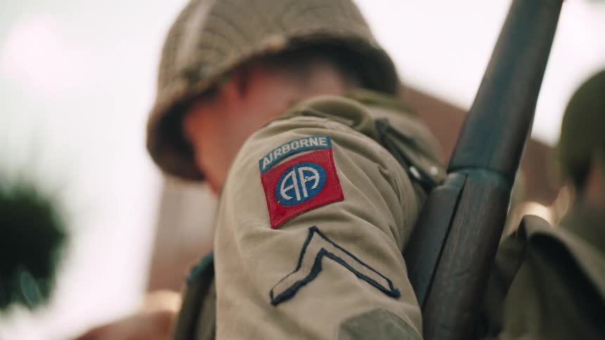 82nd airborne division soldier with rifle and visible insignia on uniform