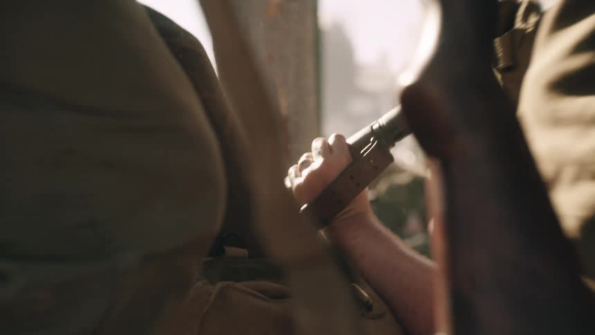 A group of soldiers with a gun