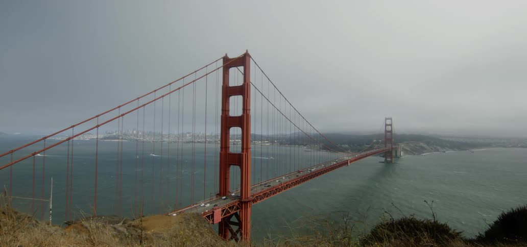 Cars drive on the golden gate bridge