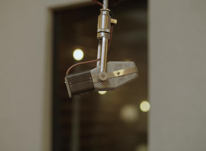 A close up of a microphone in a room