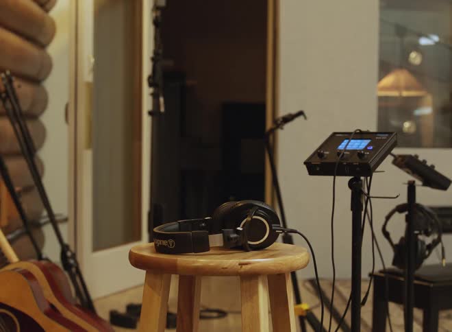 A view of some musical instruments and headphones in a studio