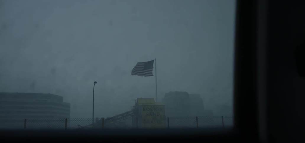 Flag blowing in the wind on a rainy day