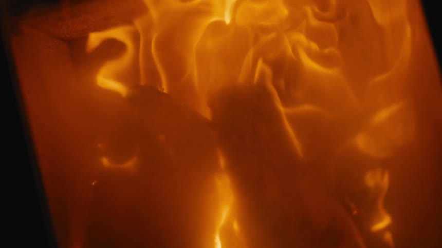 A view of a fire in a fireplace