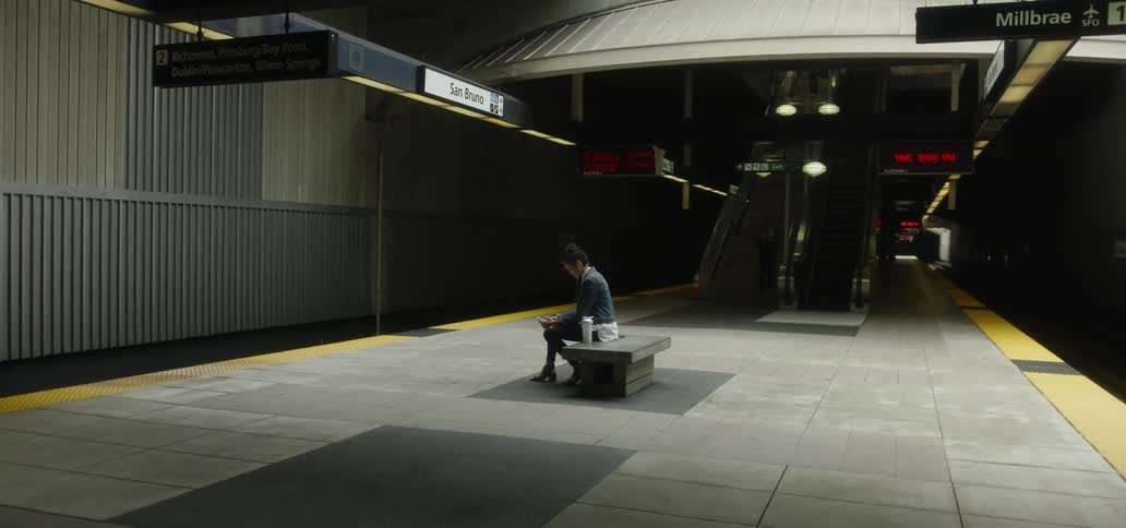 A woman waits in a subway station