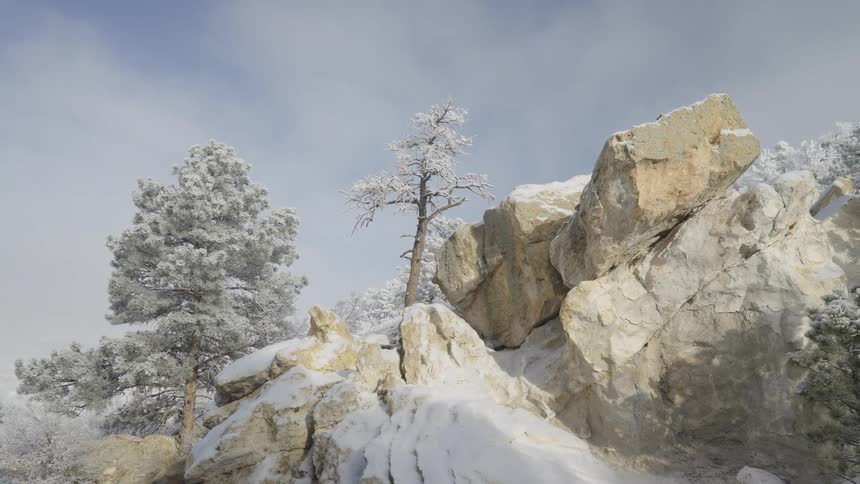 A snow covered rocky landscape with frost laced trees stands still under a soft blue sky