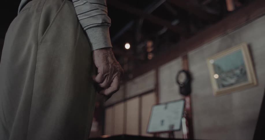 The person slowly clenches their fist